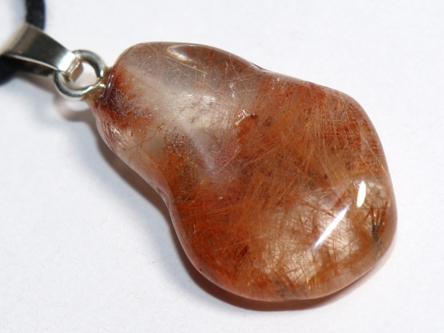 Rutilated quartz on cord