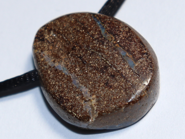 Boulder opal with cord