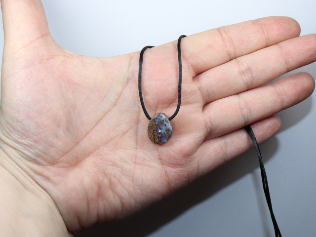Boulder opal with cord