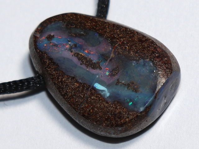 Boulder opal with cord