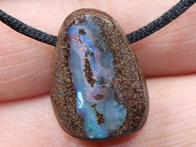 Boulder opal with cord