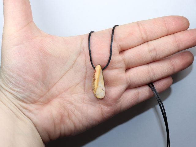 Boulder opal with cord