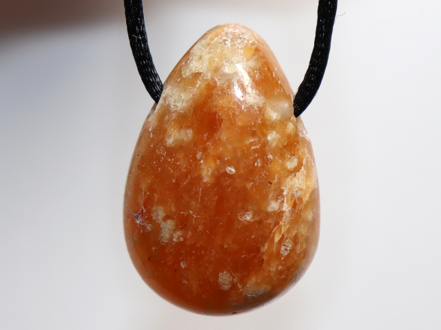 fire calcite with cord or silver 925