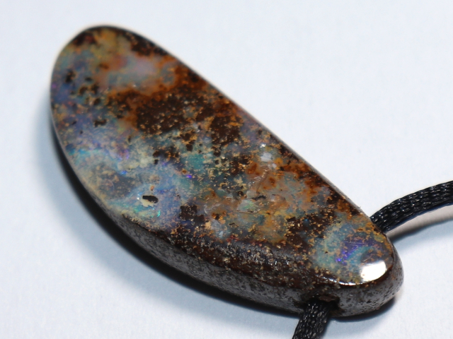 Boulder opal with cord