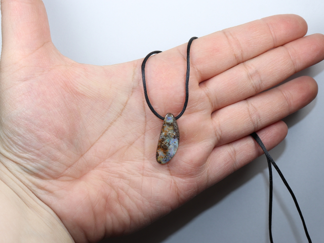 Boulder opal with cord