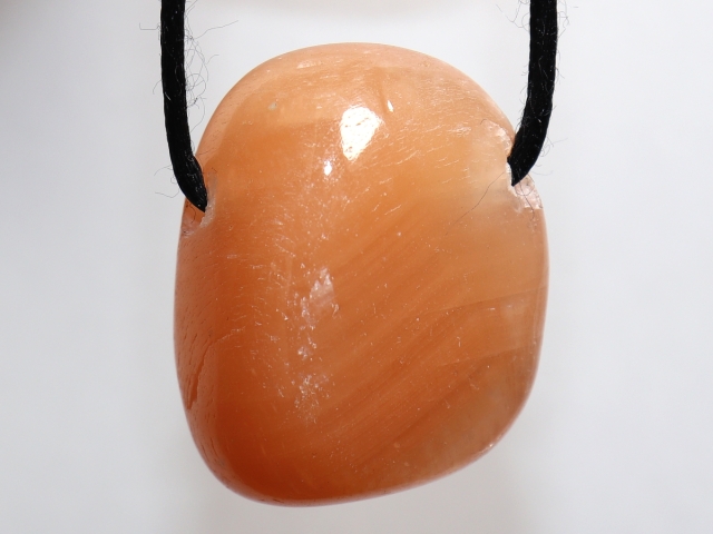 Red calcite on cord