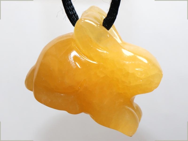 Orange calcite on cord