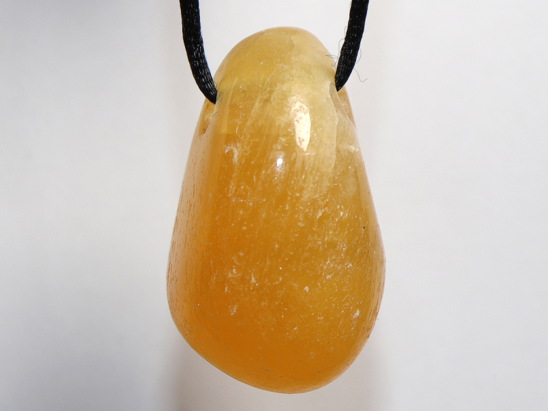 Orangencalcit mit Band oder Silber 925