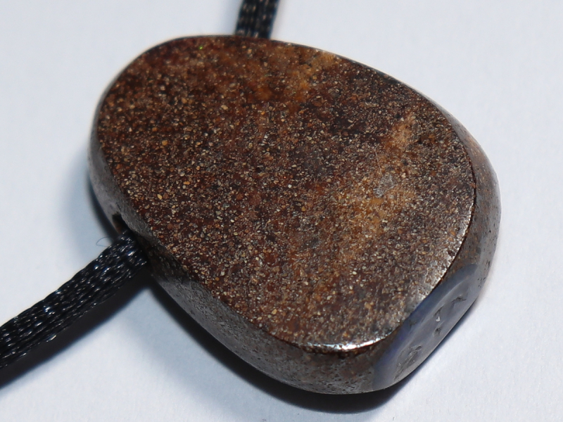 Boulder opal with cord