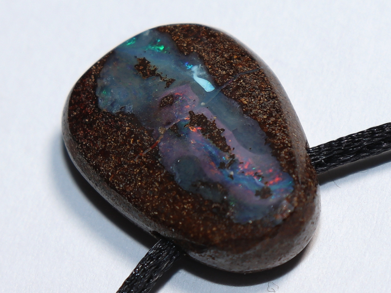 Boulder opal with cord