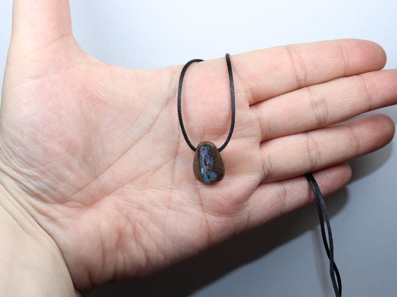 Boulder opal with cord