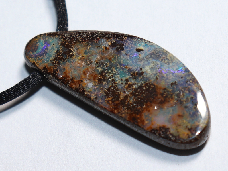 Boulder opal with cord