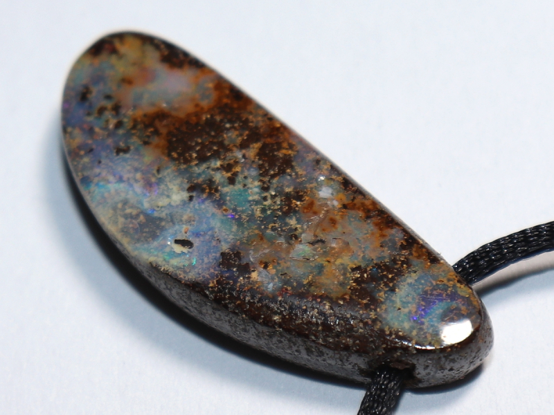 Boulder opal with cord