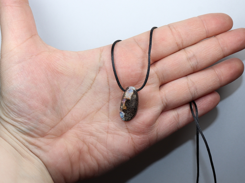 Boulder opal with cord
