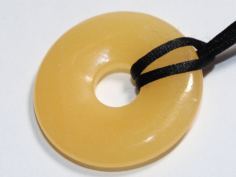 orange calcite with cord